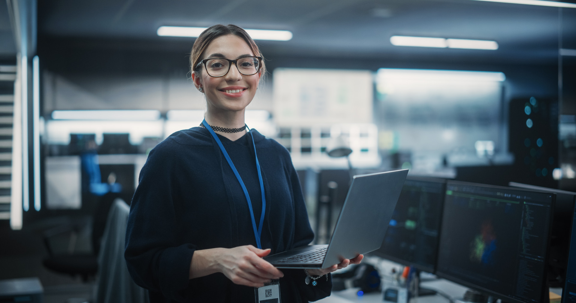 2287651247 Portrait of an Attractive Empowered Multiethnic Woman Looking at Camera and Charmingly Smiling. Businesswoman at Work, Information Technology Manager, Software Engineering Professional
